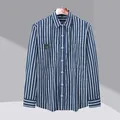 Men's blue and white vertical striped long sleeve button down shirt in business casual style. - M / Tops / Dark Blue Stripe