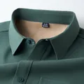 Close-up of men's dark green long sleeve shirt with warm fleece lining and collar - M / Tops / Army Green