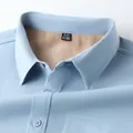 Close-up of a blue men's fleece-lined long-sleeved shirt showing the soft inner lining - Blue