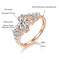 Detailed macro shot of an asymmetric marquise-cut moissanite ring in 18k rose gold plating - Rose Gold / US Size 5