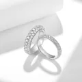 Close-up of full pave moissanite eternity rings in S925 sterling silver for couples. - US Size 4.5 / One Pair