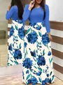 Detailed macro view showing the blue long sleeve top and floral print maxi skirt design - S / Dresses / Blue