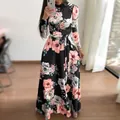 Elegantes schwarzes Maxikleid mit floralem Muster, langen Ärmeln und Taillenband. - 4XL / Kleid (Langarm) / Schwarz
