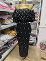 Elegant black off-shoulder bandage dress with pearl embellishments and ruffled puff sleeves. - XL / Dresses / Black