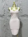 Elegant light pink bandage bodycon dress featuring a criss-cross V-neck design on a mannequin - Apricot