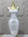 Detailed view of a silver metallic bandage dress featuring a sexy low-cut neckline. - XS / Dresses / Silver