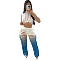 Woman wearing a stylish white distressed crop top and blue ombre shredded fringe pants - Blue