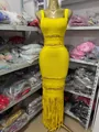 Detail showing the vibrant yellow bandage fabric and golden metallic ornaments - S / Dresses / Yellow