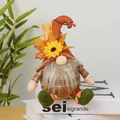 Detailed view of autumn harvest gnome plush featuring sunflower and maple leaf decoration. - Style A (Pointed Orange Hat Long Beard)