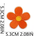 Detailed view showing 5.3cm orange flower embroidery patch for clothes decoration - Orange-Yellow Five-Petal Flower (X30YJ-072-13)
