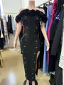 Elegant black off-shoulder bandage dress with 3D floral accents for parties. - Black