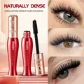 Detail view showing BMBN volumizing mascara brush and naturally dense lash effect on eyes - Black
