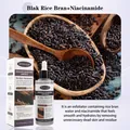 Vista detallada de la ampolla exfoliante de arroz negro Bosuya con ingredientes y caja - Negro Beige