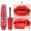 Detailed view of QICIY peel-off lip gloss showing application and vibrant red finish - Color 02