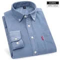 Folded light blue corduroy long-sleeved cotton shirt for men featuring a chest pocket - 39 / Tops / Blue