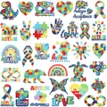 Close-up of diverse autism awareness embroidered patches with puzzle and rainbow designs - Autism Theme Set / 32 Pcs Set