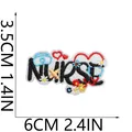 Detailed embroidered nurse patch with medical icons showing dimensions 6cm x 3.5cm for clothing - NURSE Letter Combination Style (C26XZ-068-46)
