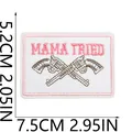 Western style embroidered patch featuring Mama Tried text and crossed revolvers design - Pistol Style (X11NZ-138-03)
