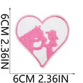 Detail view showing 6cm x 6cm dimensions of pink heart cowgirl embroidery patch. - Heart Galloping Horse Silhouette Style (X11NZ-09-20)