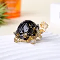 Handmade resin turtle figurine with black obsidian and gold foil accents. - Obsidian + Gold Foil