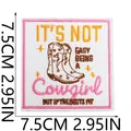 Close-up of a 7.5cm square embroidered patch featuring cowgirl boots and text. - Cowboy Boot Heart Quote Style (X11NZ-195-33) / Pink