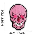 Detail of a pink skull embroidery patch showing dimensions 6x4cm for sewing projects. - Skull Style (X11NZ-088-49)