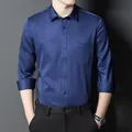 Slim fit navy blue long-sleeve business casual shirt for men shown on model - Dark Blue