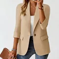 Detail shot of khaki women's 3/4 sleeve blazer jacket with a stylish single button - Apricot