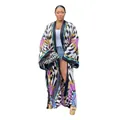 Stylish full-body display of a colorful geometric print loose long sleeve kimono cardigan - One Size / Tops / Black White Grid Purple Flower