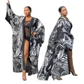Full-body view of a long-sleeved kimono duster with black and white abstract print - One Size / Tops / Black and White Pattern