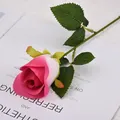 Artificial pink velvet rose with green leaves on a magazine background - Flower head diameter 7cm / Snow Mountain Rose (Rose Red)