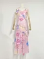 Detailed view of an elegant pink floral vacation dress with ruffled tiers and a V-neckline - S / Dresses / Pink