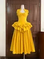 Detail showing yellow layered ruffle cake dress with structured fishbone corset bodice - Golden Yellow