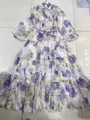 Close-up detail of a floral V-neck midi dress featuring lantern sleeves and a tiered skirt - S / Dresses / Purple Floral Long Style
