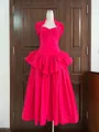 Hot pink halter ruffled tiered maxi dress with boned bodice on mannequin - Pink
