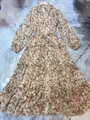 Detailed view of a floral paisley maxi dress with tiered ruffles and V-neckline. - S / Dresses / Beige Paisley Floral (Long Style)