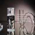 Detail showing 88ml fragrance mist bottle with Raspberry and Amber scent notes - NIGHT (Black) / Single Bottle