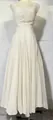 Elegant white pleated sweetheart neckline maxi dress with a flowing skirt for spring 2026. - White