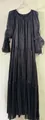 Close-up detail view of elegant black pleated maxi dress with pearl neck and tie-up design - S / Dresses / Black