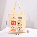 Bolso de lona crema con tierno dibujo de dinosaurio y frases de la suerte, 34x38 cm - Estampado de dinosaurio Paz y Alegría / 34x38cm / Blanco Roto