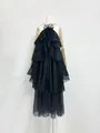 Detail view of a French-style black ruffled maxi dress with a 3D flower halter neck - S / Dresses / Black