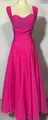 Elegant hot pink sleeveless dress with pleated bodice and a flared long skirt detail. - Pink