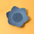 Detailed macro view of a blue lotus-shaped silicone soap dish with drain holes and spikes - 12.5cm (No Packaging) / Navy Blue