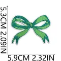 Close-up of a green embroidered bow patch with precise length and width measurements - Bowknot Style (X25HL-072-06)