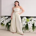 Elegant white two-piece set with ruffled crop top and high-waisted wide-leg pants - S / Top And Bottom / White