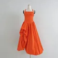 Vibrant orange halter neck bustier maxi dress featuring elegant pleated details - Orange