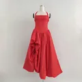 Elegant vintage red halter maxi dress featuring a pleated voluminous skirt and waist fit - Red