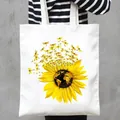 Close-up of white canvas tote bag featuring vibrant sunflower and dragonfly print detail. - Sunflower Map and Dragonfly Style (23)