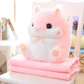 Detailed view of pink hamster plushie sitting on a soft folded faux fur blanket. - Pink Hamster
