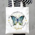 Detail showing a white canvas tote bag with a beautiful blue butterfly and quote - Butterfly and English Quote Style (14)